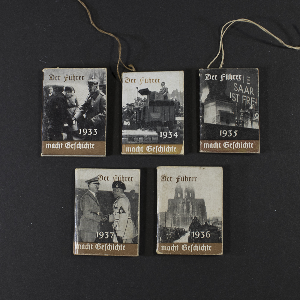 Front view of the Winterhilfswerk book set Der Führer mach geschichte.