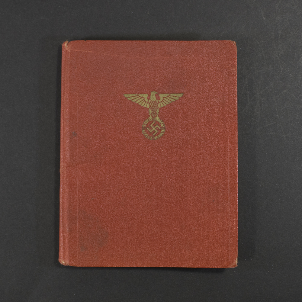 Front cover of a German World War II–era NSDAP membership book, showing the title and worn cover consistent with period use.