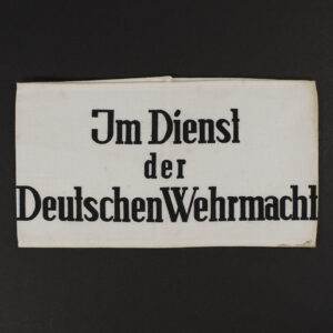 Overview of 1941 German Wehrmacht civilian service armband showing white fabric with black printed text on the front.