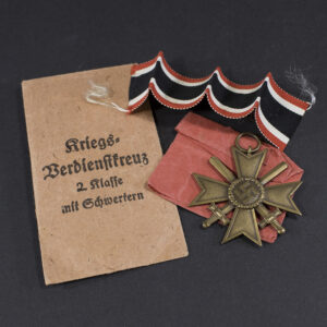 Overview of a WW2 German War Merit Cross without Swords displayed with its original presentation bag.