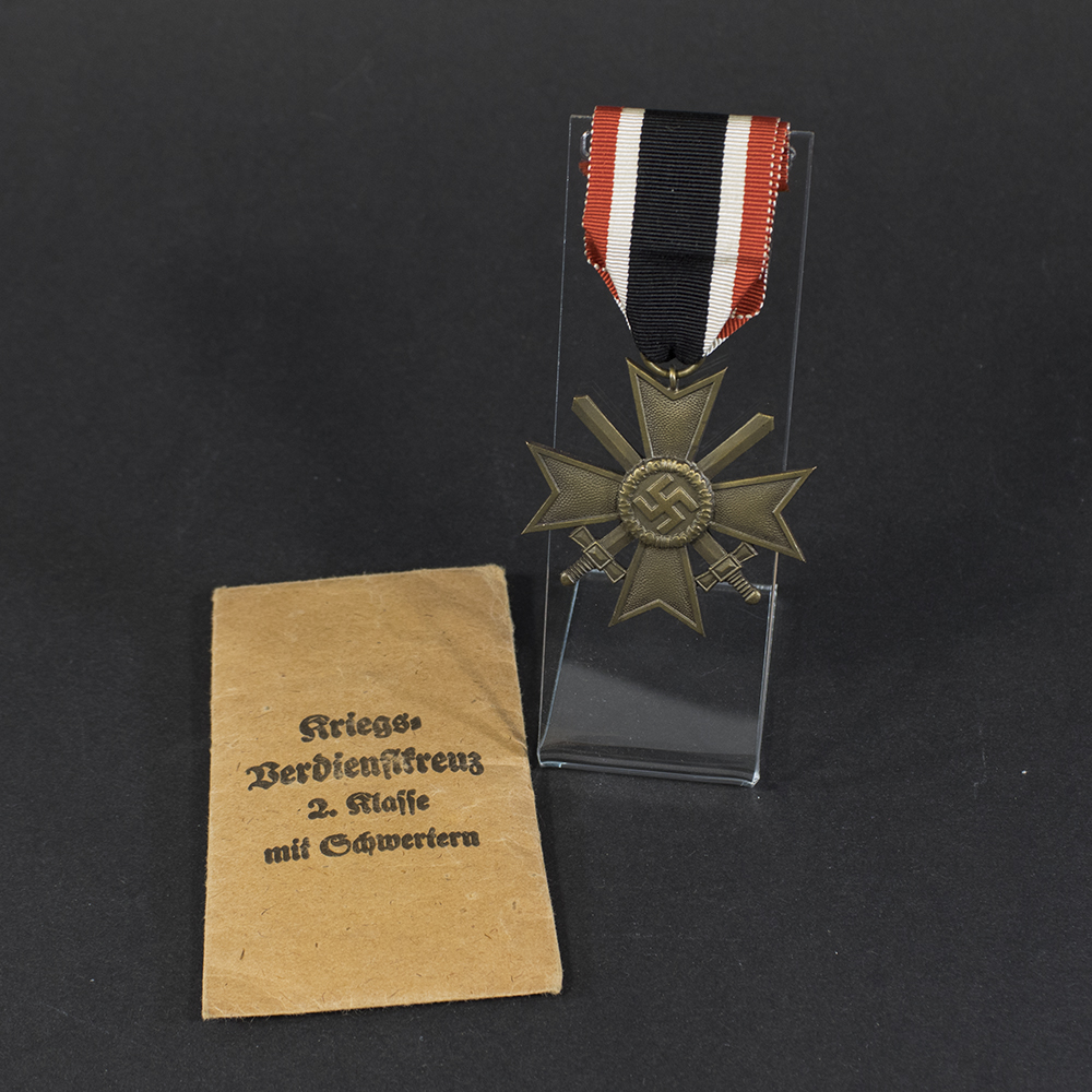 Overview of a WW2 German War Merit Cross without Swords displayed with its original presentation bag.”
