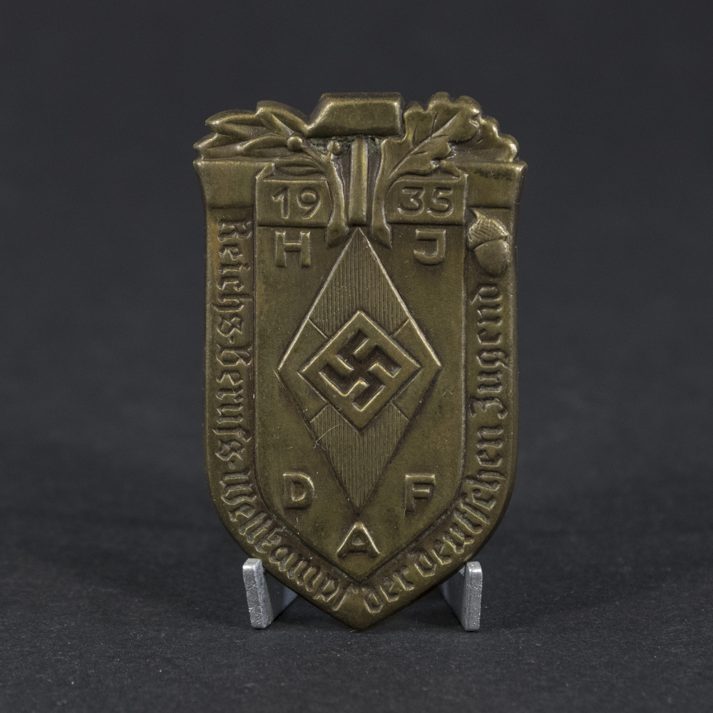 Overview of a WW2 German tinnie issued for the Reichs‑Berufs‑Wettkampf der Deutschen Jugend 1935.