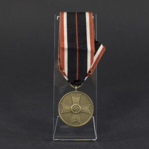 Overview of a World War II-era German War Merit Medal, shown with its ribbon, displaying the round bronze medal suspended from a striped ribbon against a neutral background.