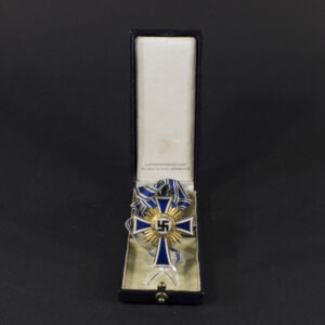 Overview of a WW2 German Golden Mother’s Cross displayed inside its original presentation case.