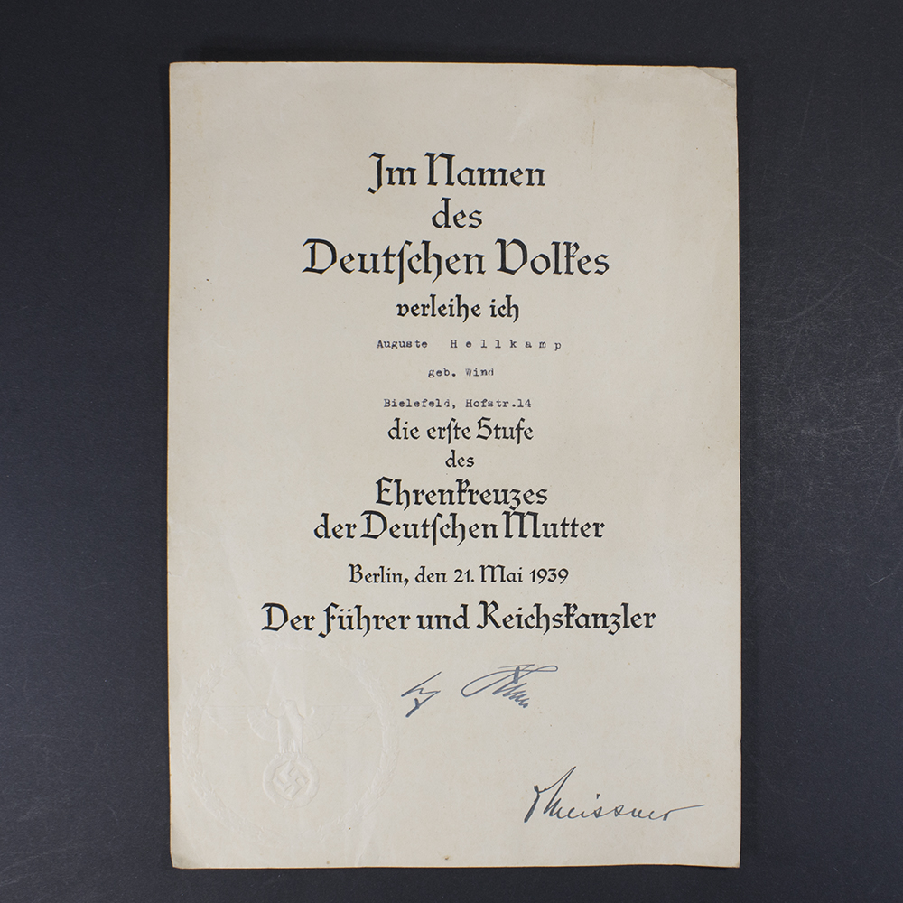 Front view of a WW2 German Golden Mother’s Cross award document showing the printed text and layout.