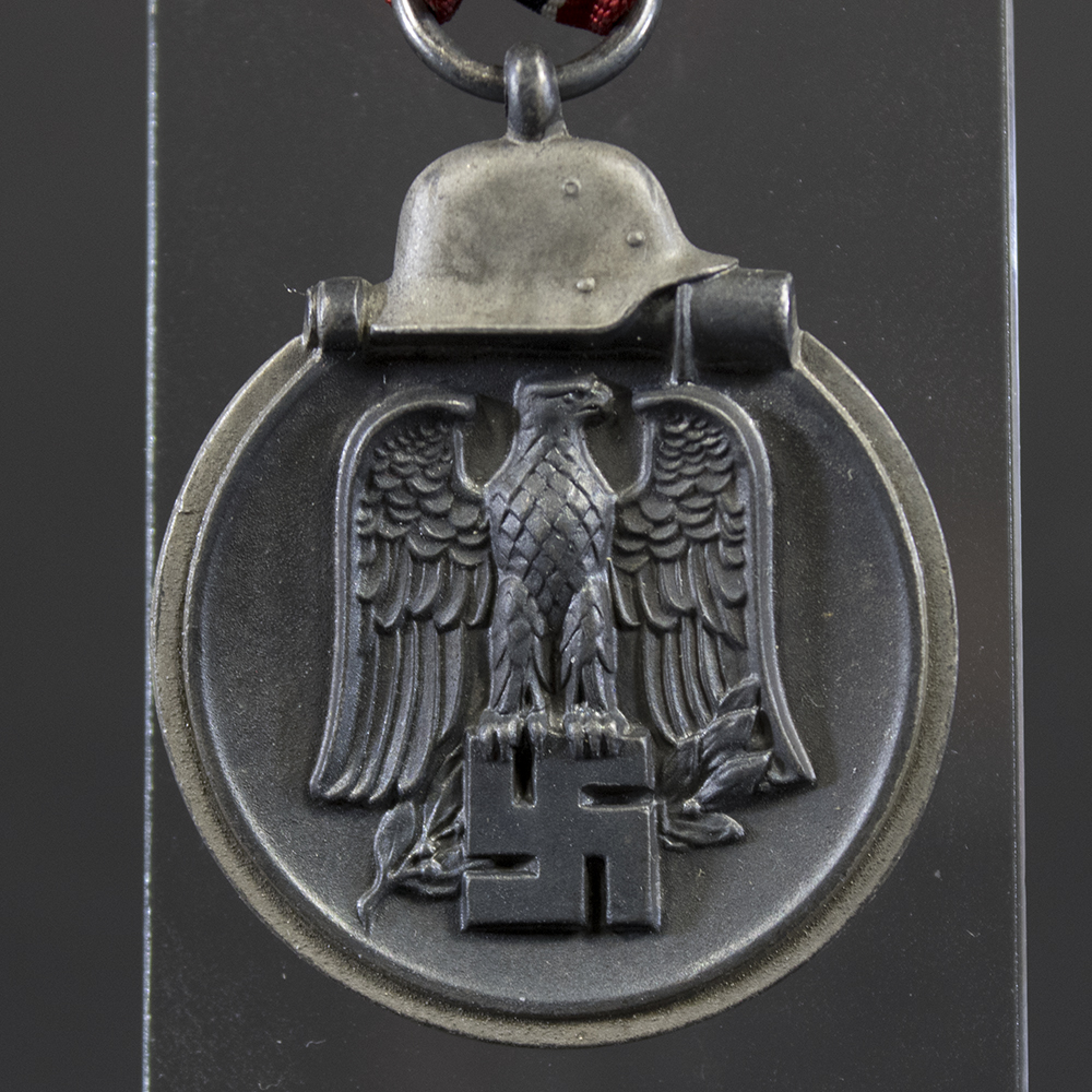 Close-up front of German WW2 Eastern Front Medal showing helmet and eagle design