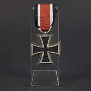 Beautiful WW2 Iron Cross 2nd Class overview showing complete medal with original ribbon in very good condition.