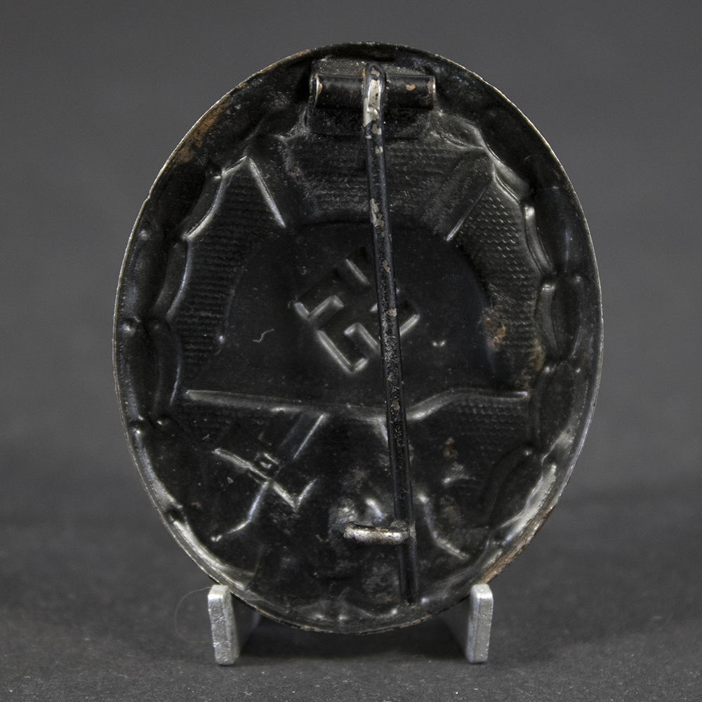 Close-up reverse of German WW2 Black Wound Badge showing pin setup and condition