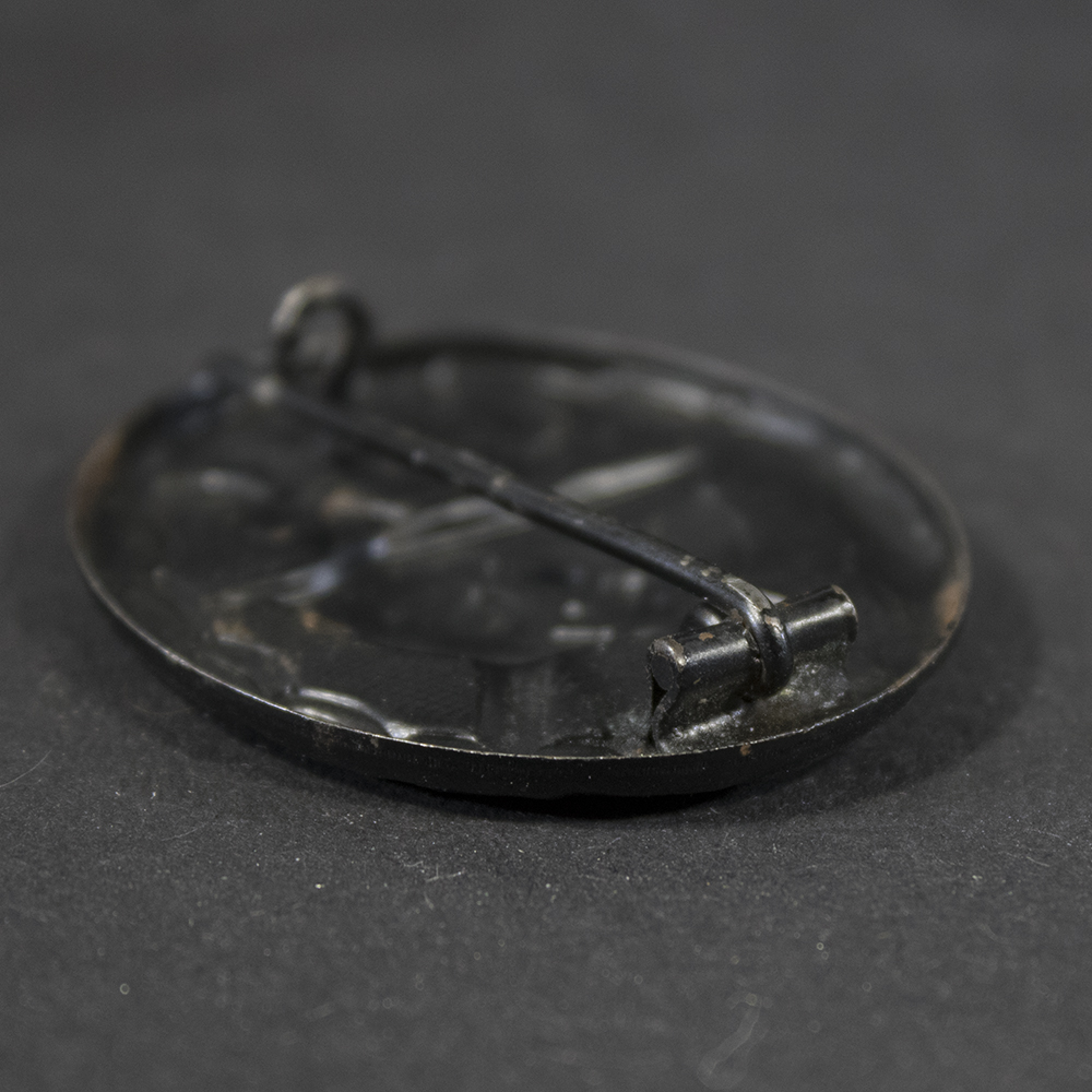 Close-up of hinge on German WW2 Black Wound Badge showing construction detail