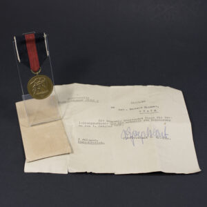 WW2 German Sudeten Occupation Medal set overview showing medal, original bag and document