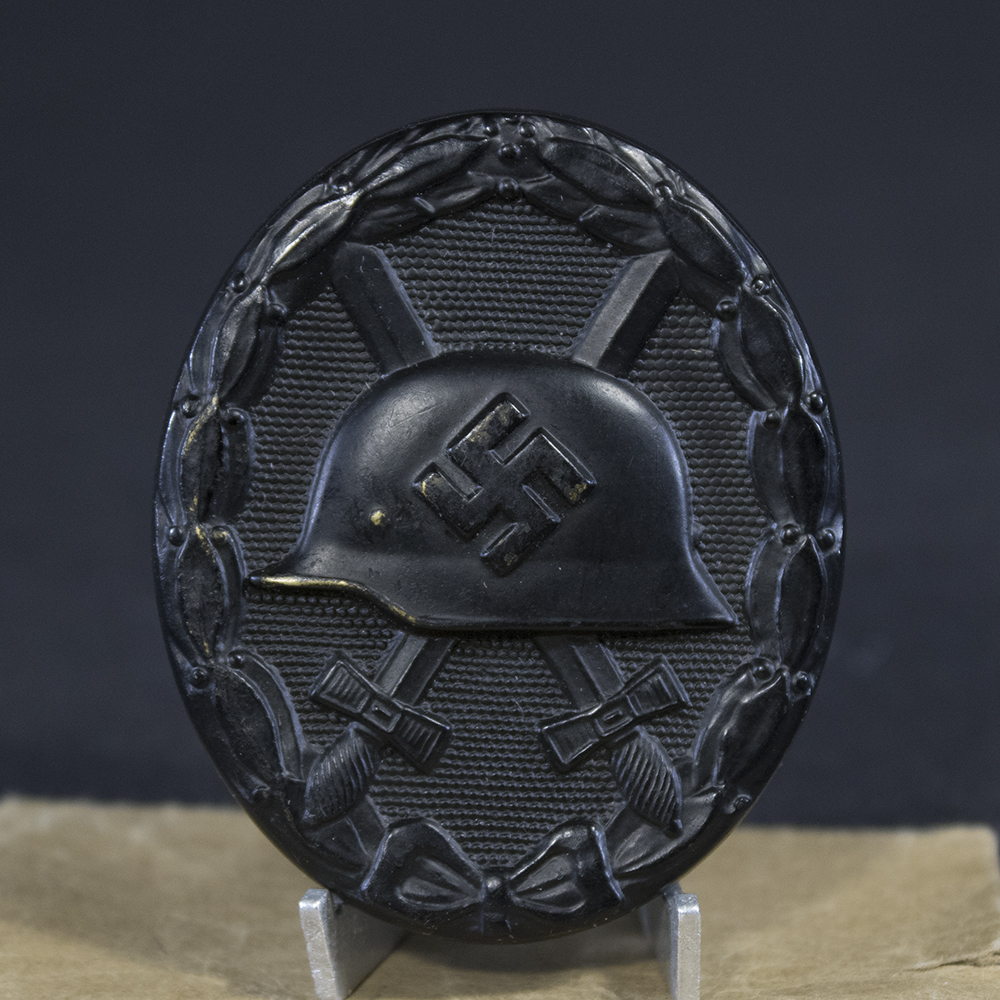Close-up front of WW2 Black Wound Badge showing design and surface detail