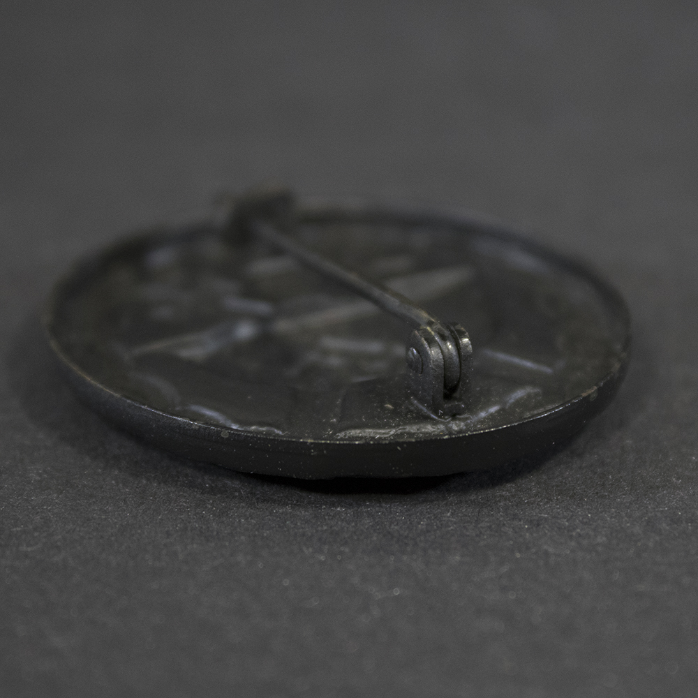 Close-up of hinge on WW2 Black Wound Badge showing construction detail