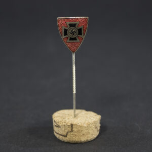 Overview of a World War II-era German Kyffhäuserbund membership pin, showing the shield-shaped badge and reverse needle attachment.
