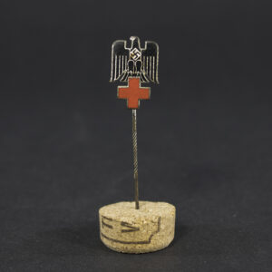 Overview of a German Red Cross (DRK) membership pin from the Nazi era, showing the complete badge and its overall condition.