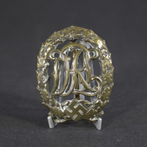 Overview of a WWII German Bronze DRL Sports Badge with original bronze finish, maker marked Wernstein Jena on the reverse.