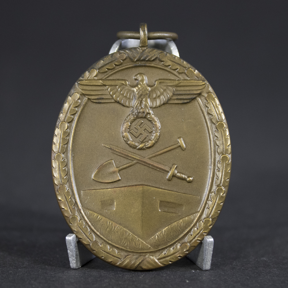 Close-up of the front of a West Wall Medal showing the detailed Deutsches Schutzwall-Ehrenzeichen design and ribbon.