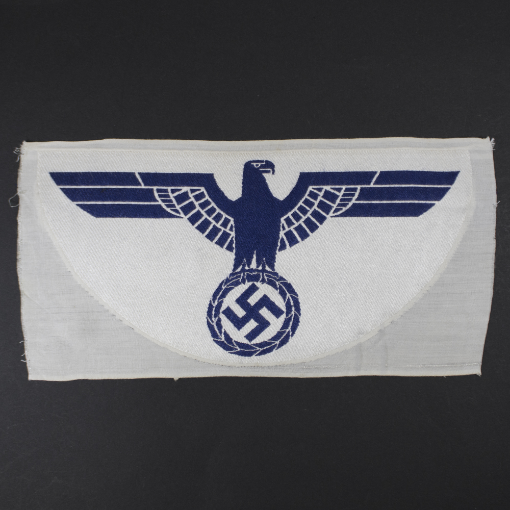 Overview of an original WWII 1st pattern Kriegsmarine Sport Breast Eagle, a rare German naval sports insignia in excellent condition.