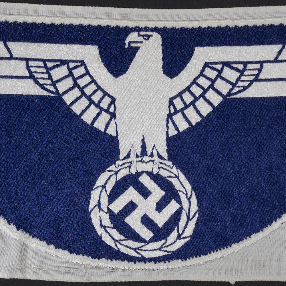 Close-up of the reverse of a WWII Kriegsmarine Sport Breast Eagle highlighting stitching, backing, and manufacturing details.