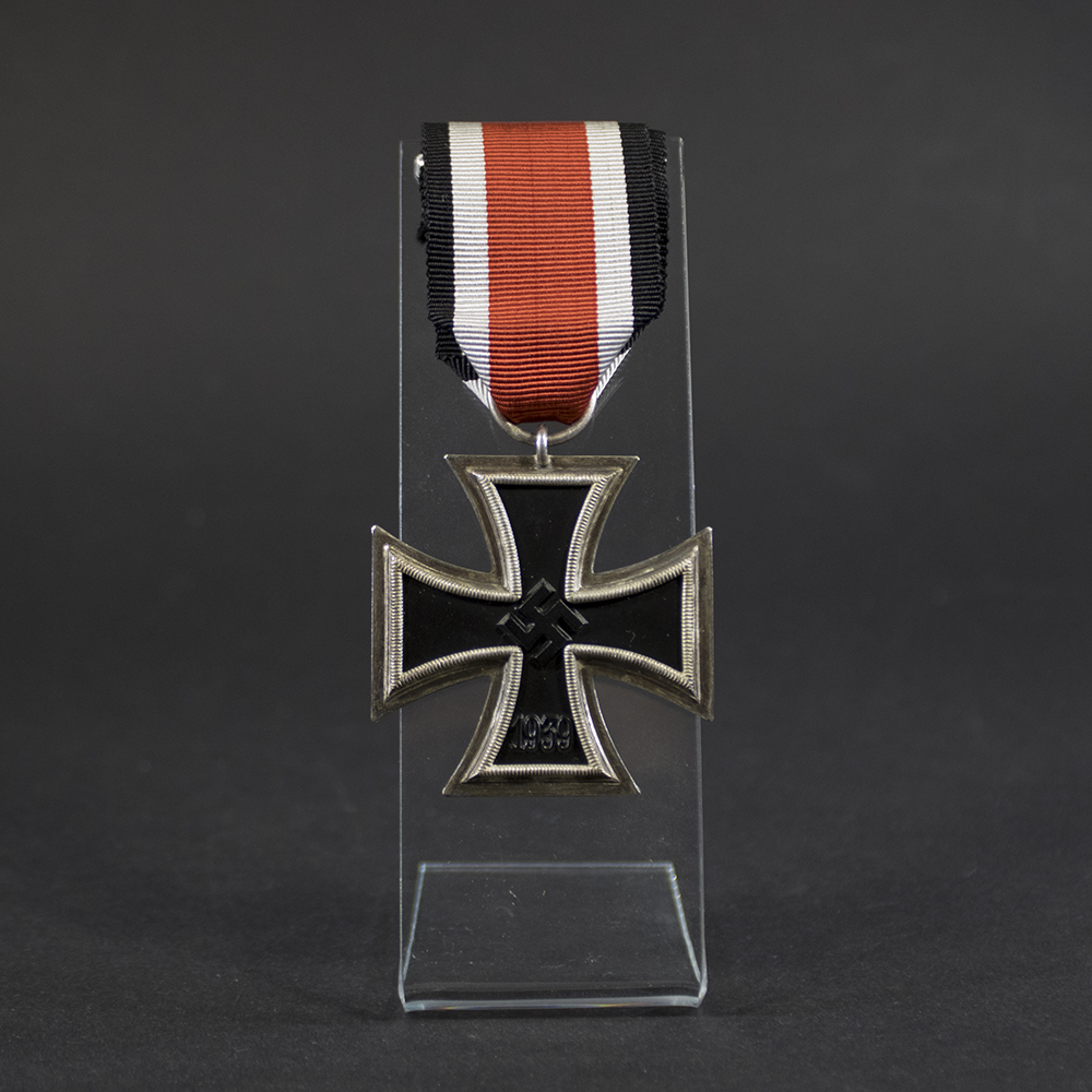 German World War II Iron Cross 2nd Class medal displayed in full view, showing the black iron core with a silver-colored frame and the attached suspension ring with ribbon.