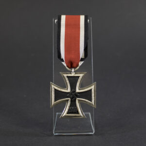 German World War II Iron Cross 2nd Class medal displayed in full view, showing the black iron core with a silver-colored frame and the attached suspension ring with ribbon.