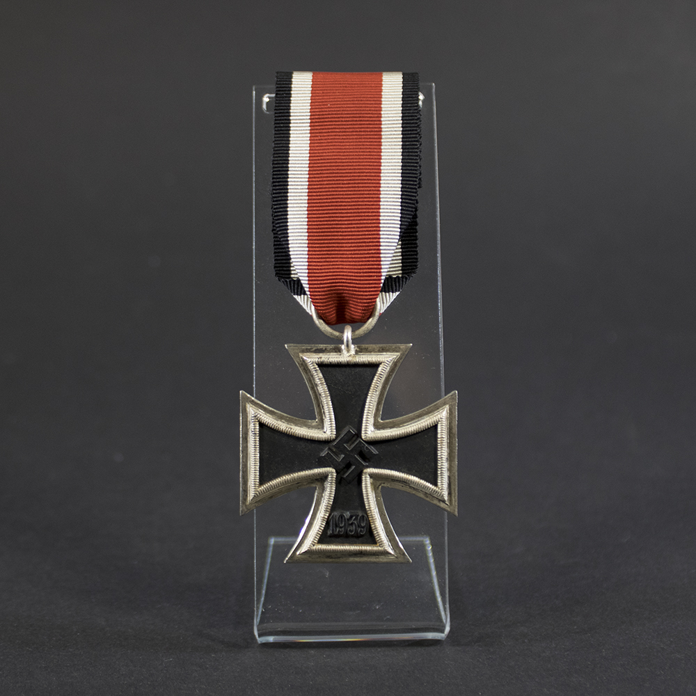 German World War II Iron Cross 2nd Class medal displayed in full view, showing the black iron core with a silver-colored frame and the attached suspension ring with ribbon.