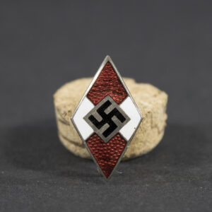 Overview of an RZM 11-marked Hitler Youth membership pin, displayed in full view to show the diamond-shaped design, enamel finish, and overall condition of the badge.