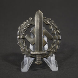 Overview of a World War II German Bronze SA Sports Badge, displayed in full view to show the complete wreath design, central sword motif, and overall condition of the award.