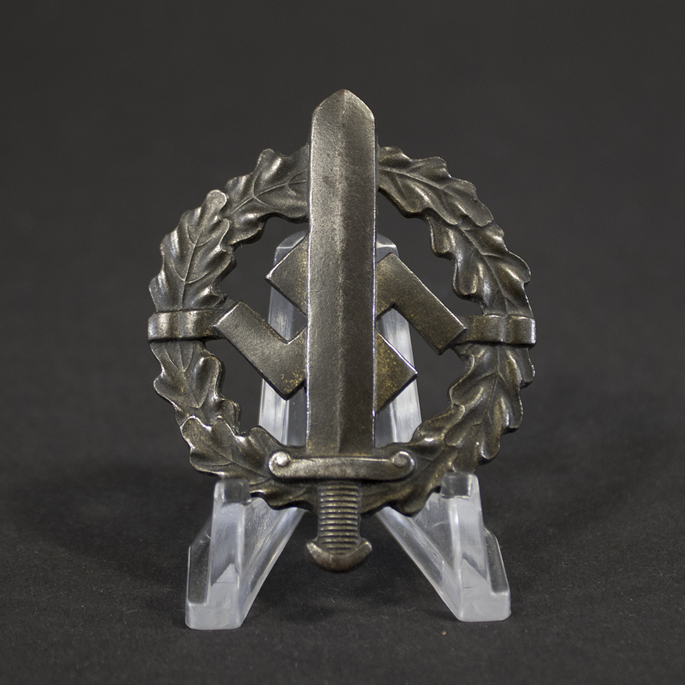 Overview of a World War II German Bronze SA Sports Badge, displayed in full view to show the complete wreath design, central sword motif, and overall condition of the award.