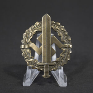 Overview of a World War II German Bronze SA Sports Badge, displayed in full view to show the complete wreath design, central sword motif, and overall condition of the award.