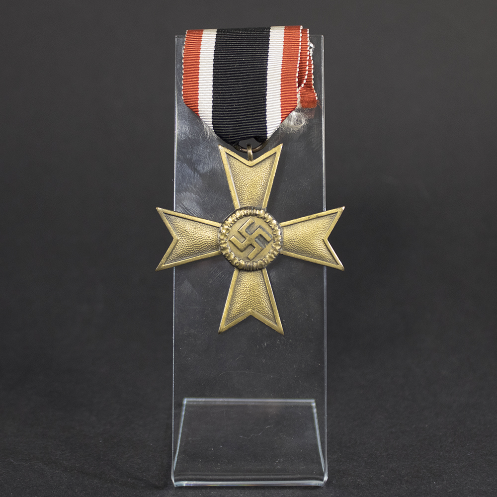War Merit Cross with Swords, 2nd Class, suspended from its original ribbon. Bronze-toned cross with crossed swords between the arms, shown in full view against a plain background.