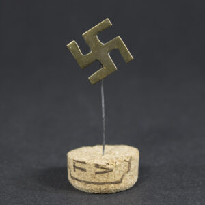 Original Third Reich Swastika Stickpin overview showing the complete lapel pin with tombak construction, age-related wear, and partial loss of the silver finish.