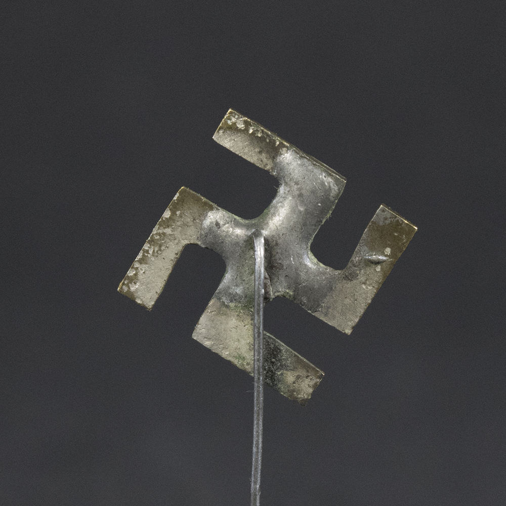 Close-up reverse view of an original Third Reich Swastika Stickpin showing the back construction, pin attachment, and authentic age-related wear.