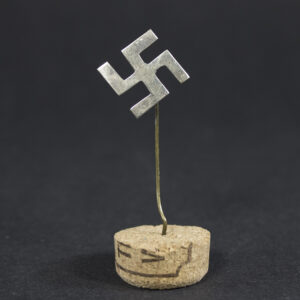 Original Third Reich Swastika Stickpin overview showing the complete lapel pin with tombak construction, age-related wear, and partial loss of the silver finish.