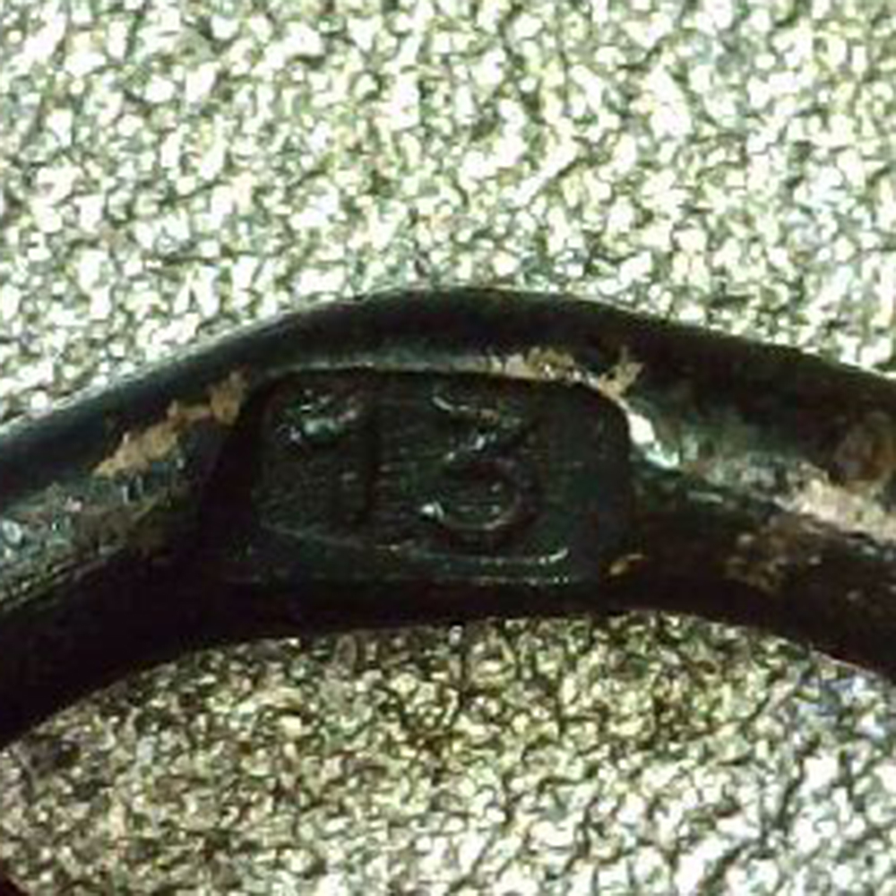 Close-up of the Gustav Brehmer maker stamp on the reverse of the Eastern Front Medal issue bag, showing the manufacturer's details clearly.