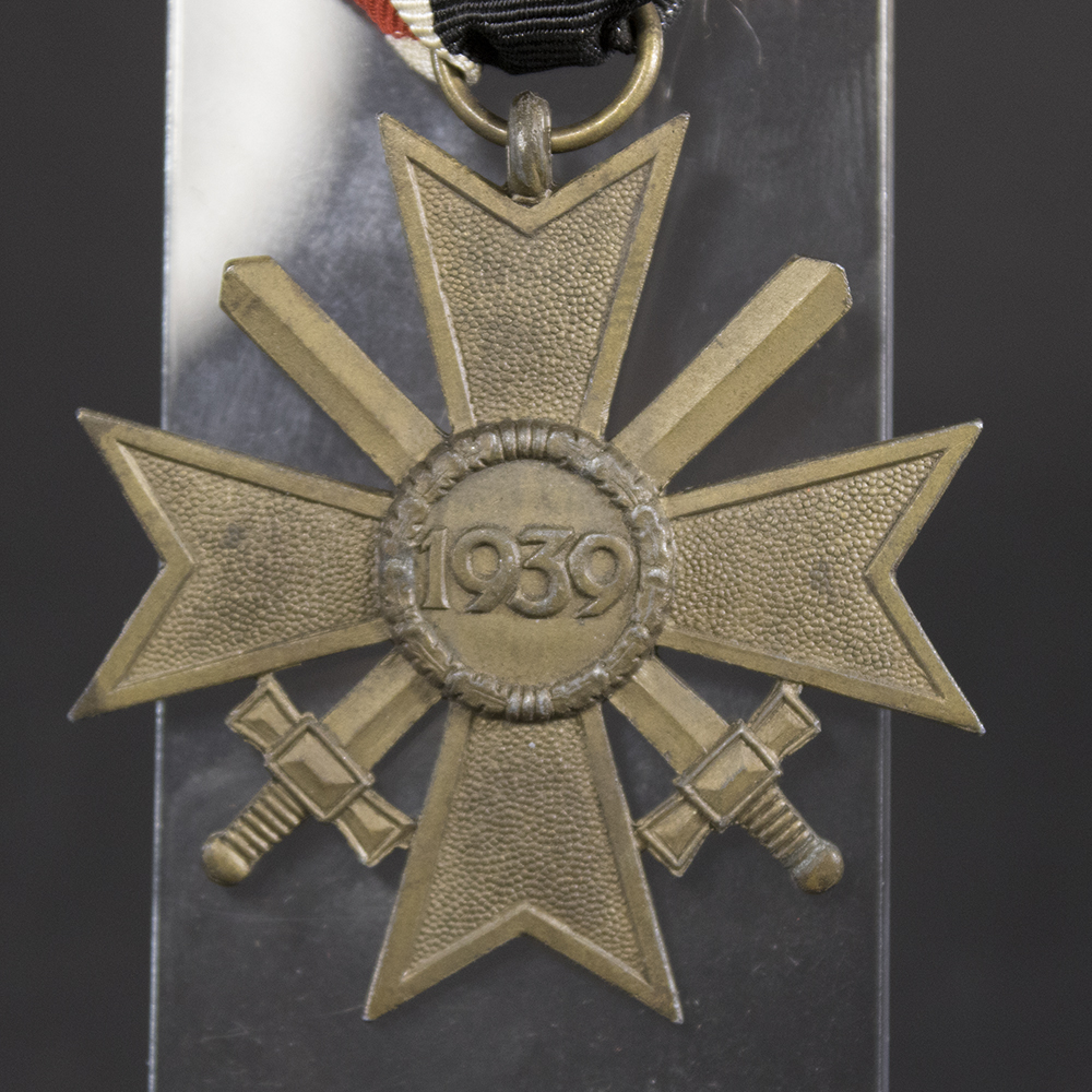 Close-up reverse view of the War Merit Cross with Swords, showing the original finish, construction details, and period wear.