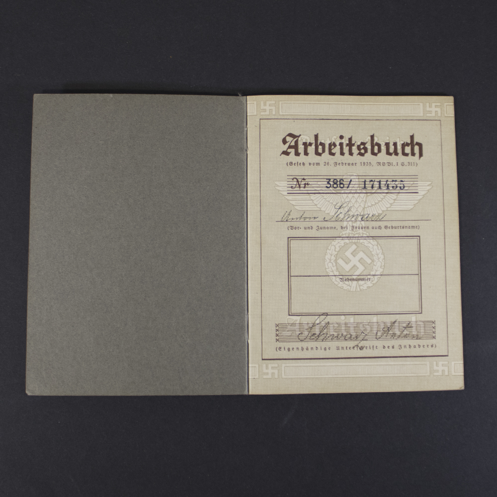 Interior page of a German WWII labor book displaying the owner's personal information, identification details, and official stamps.