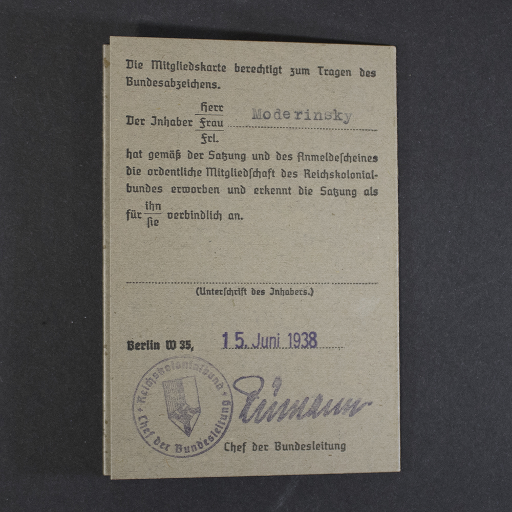 Back of an original Reichskolonialbund membership card containing the membership authorization statement, issue date, official organizational seal, and handwritten signature confirming membership status.
