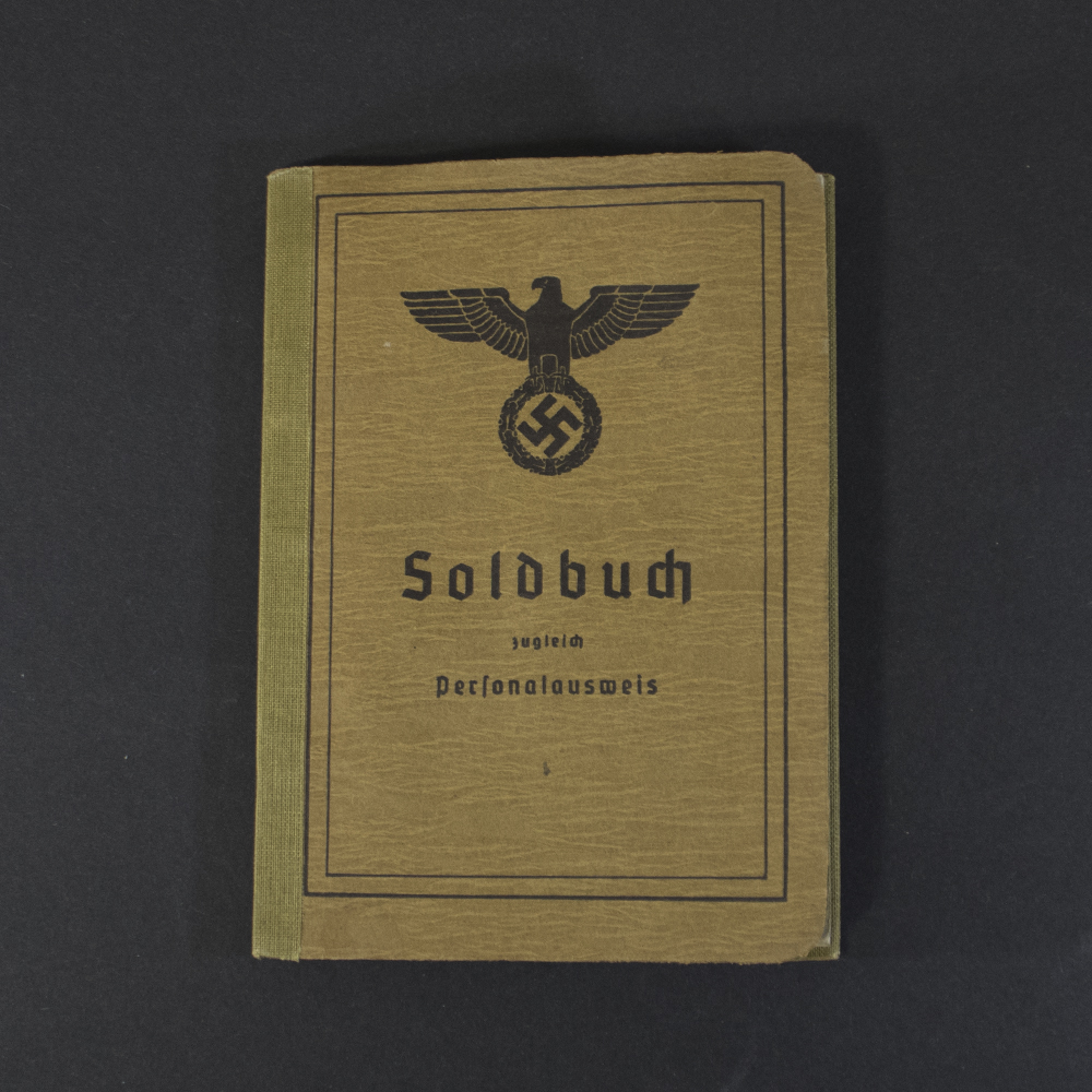 Front cover of an original German WWII Soldbuch, featuring the title "Soldbuch zugleich Personalausweis" and the military eagle emblem on a brown card cover.