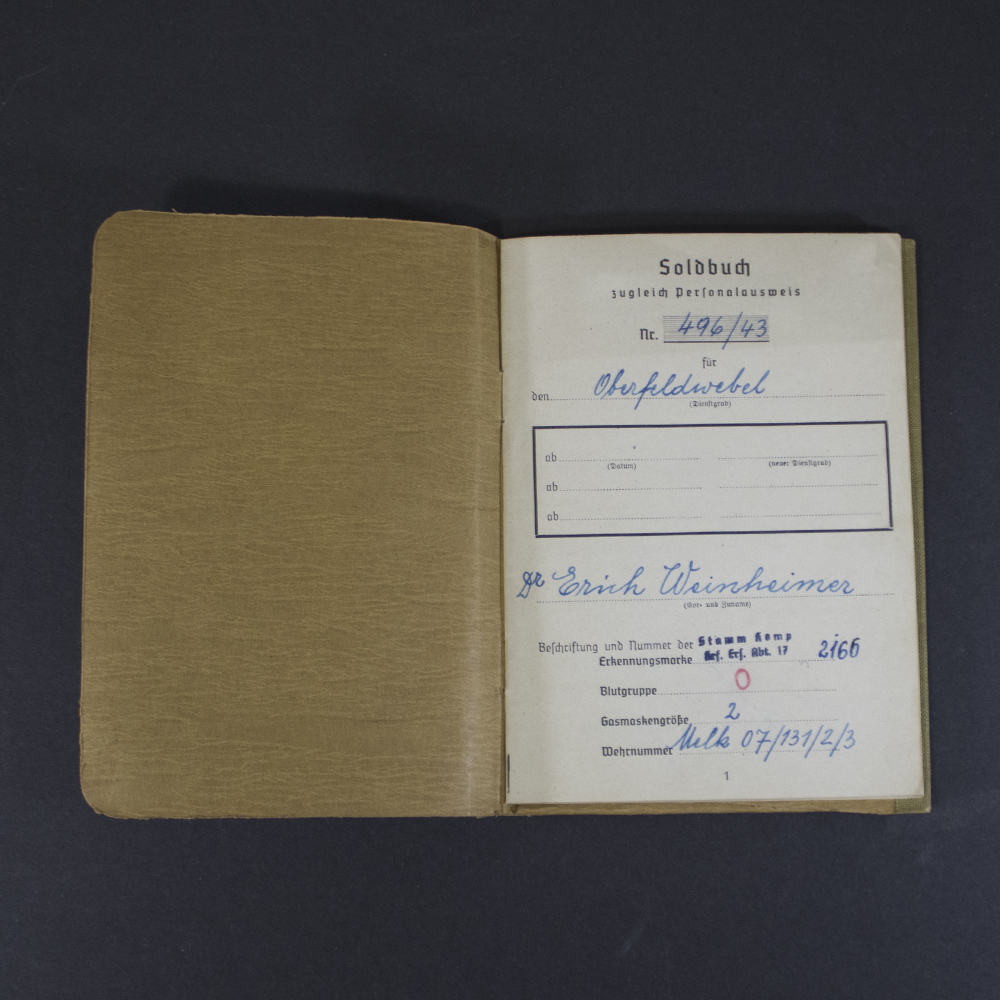 Opening pages of a German WWII Soldbuch issued to an Oberfeldwebel, showing identification details, document number, unit information, and handwritten entries.