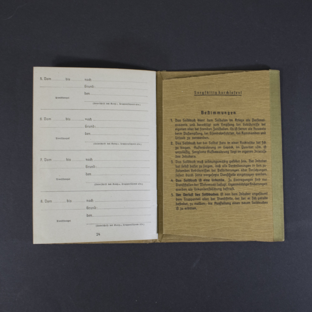 Rear interior pages of a German WWII Soldbuch showing administrative transfer entries, service record sections, and printed instructions for the document holder on the inside back cover.