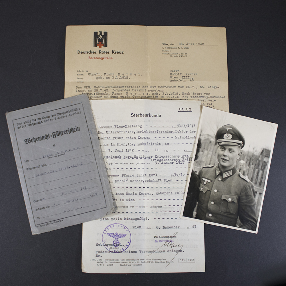 Collection of original German WWII documents, including a Wehrmacht driver's license, death certificate, Red Cross correspondence, and a portrait photograph of a uniformed German soldier.