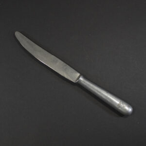 WW2 Luftwaffe canteen knife with aluminum handle and steel blade on a dark background.