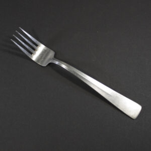 WW2 German Beauty of Labour stainless steel canteen fork on a dark background.