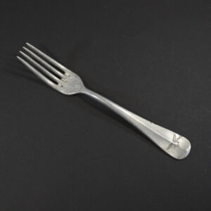 WW2 German Luftwaffe aluminum canteen fork on a dark background showing the property eagle.