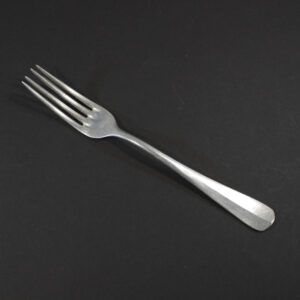 Front view of a WW2 German Kriegsmarine aluminum canteen fork on a dark background.