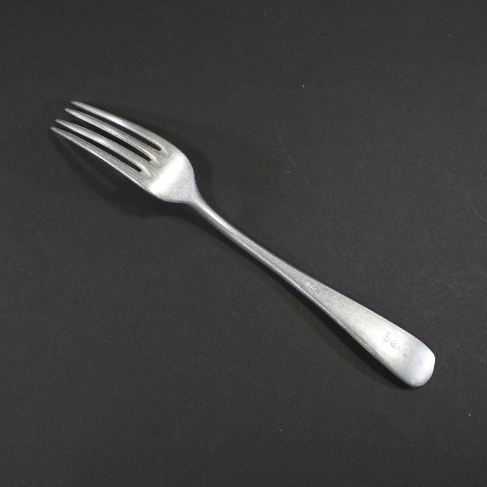 Reverse side of the German Navy mess hall dinner fork showing stamped neck and handle marks.