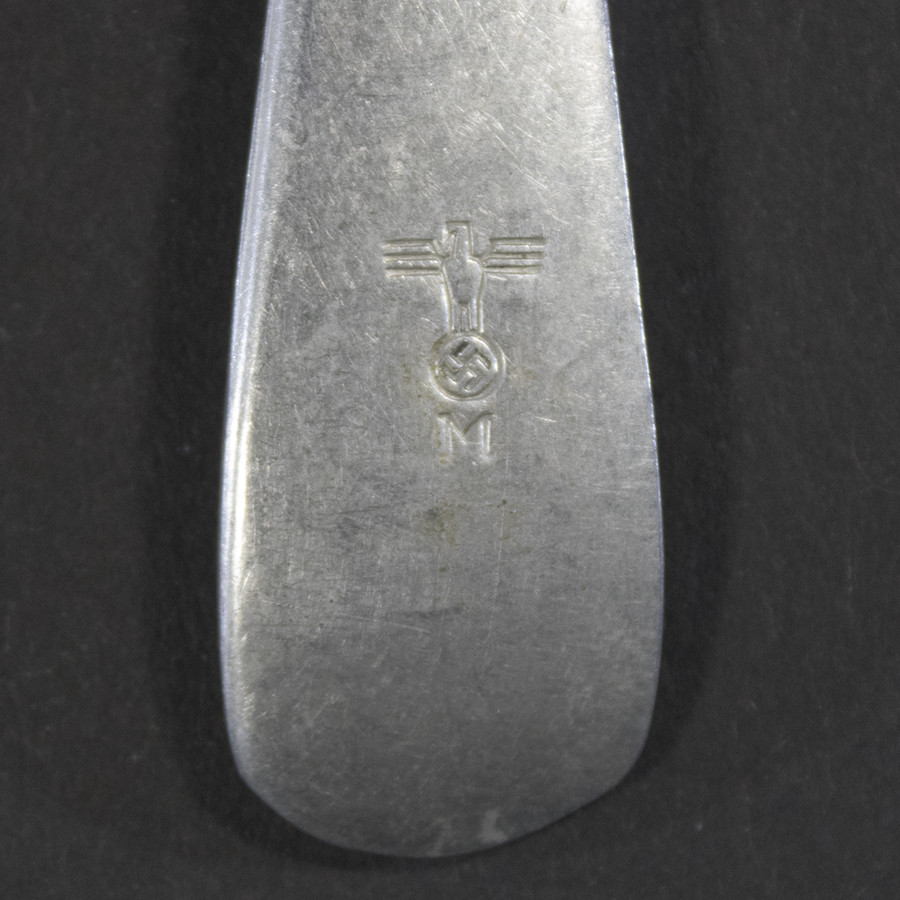 Detailed close-up of the Kriegsmarine naval eagle and 'M' property stamp on the fork handle base.