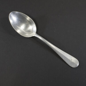 WW2 German Luftwaffe aluminum mess hall spoon on a dark background showing the property eagle.