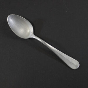 WW2 German Luftwaffe aluminum canteen dessert spoon on a dark background showing the property eagle mark.