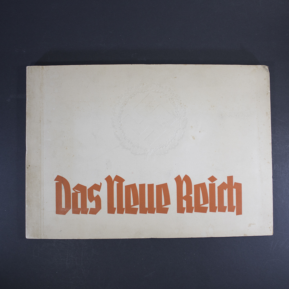 Front cover of the WW2 Bilderalbum Das Neue Reich featuring embossed eagle emblem and red Fraktur lettering.